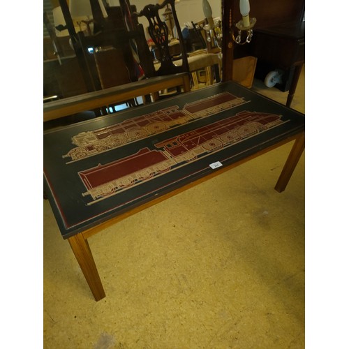 255 - Mid century teak table with train designed top in leather .