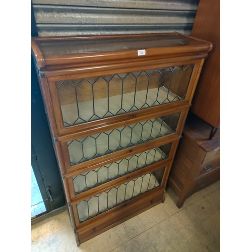 239 - Beautiful example of a Wernicke 4 tier book case with leaded glass design .