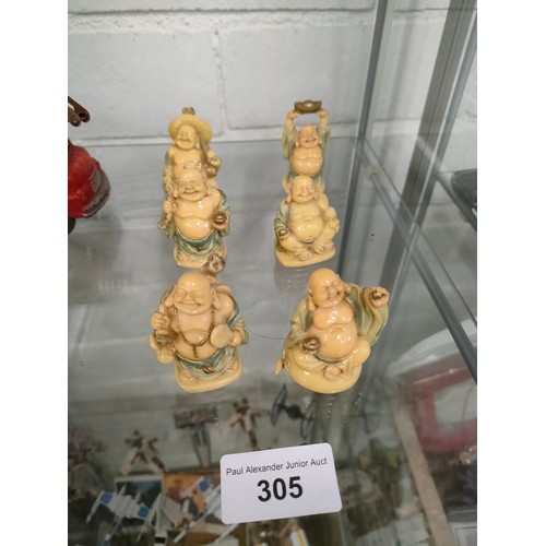 305 - Lot of oriental small buddha figures .