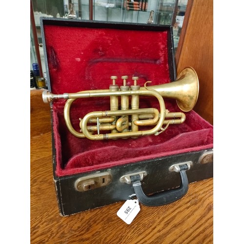 295 - Boosey and hawks brass trumpet with mouth piece and fitted box .