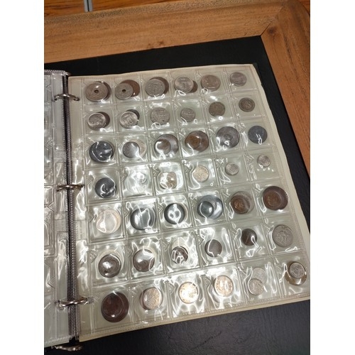 284 - Large album of foreign coins etc .