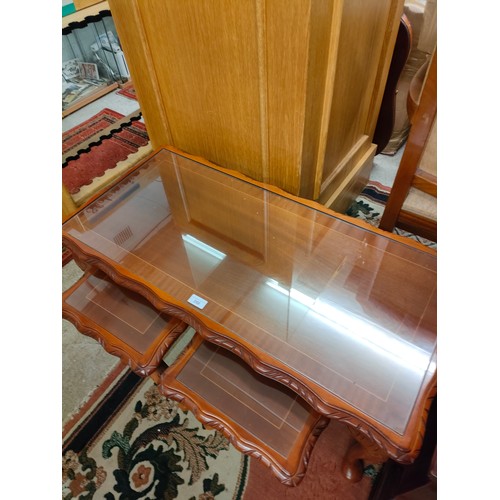 268 - Rosewood style coffee table with nest of 2 table inserted with glass preserves .