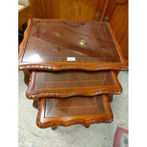 267 - Rosewood style Nest of 3 tables with glass inserts.