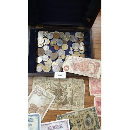 373 - Lot of coins and notes .