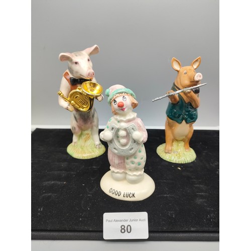 80 - 2 piece beswick pig band together with beswick clown figure .