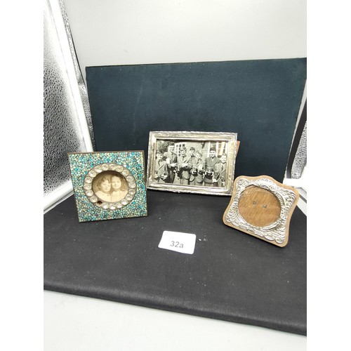 32a - 2 silver photo frames together with vintage mirror .