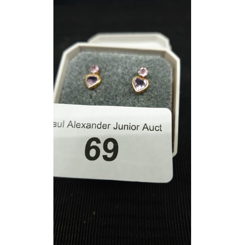 69 - 9ct gold and Amethyst pierced earrings.