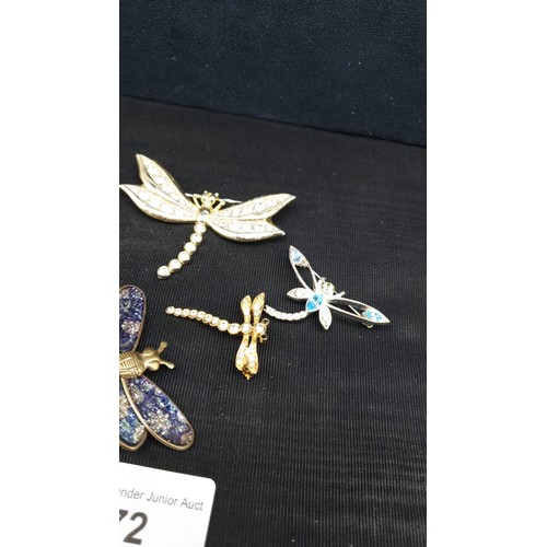 72 - Lot of dragonfly brooches .