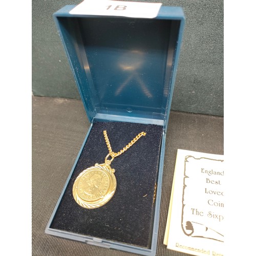 1b - 2 Boxed six pences coins pendant s with chain s .