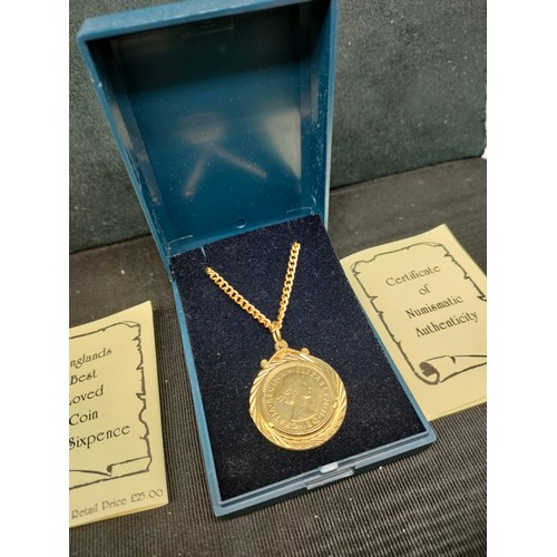 1b - 2 Boxed six pences coins pendant s with chain s .