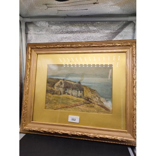 552 - old Scottish water colour of cottage with thatched roof signed by artist fitted in gilt frame .