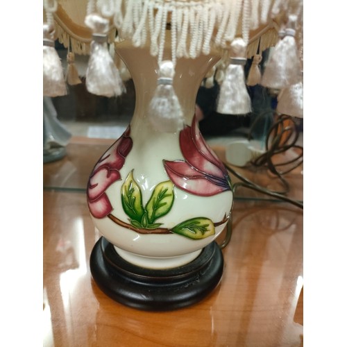 17 - Moorcroft cream back ground table lamp with orchid design .