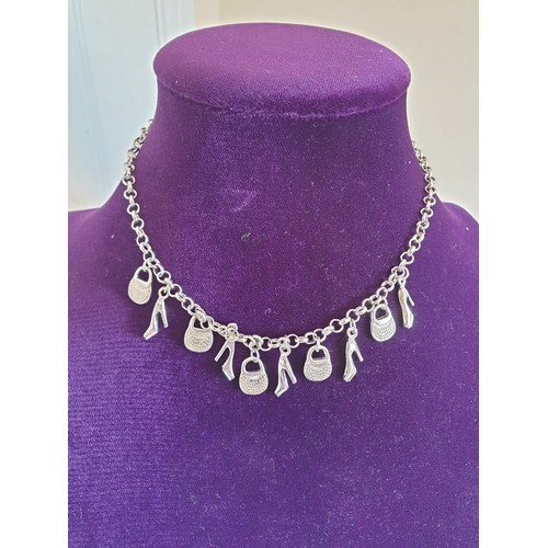 60 - White Metal Necklace With Charms .