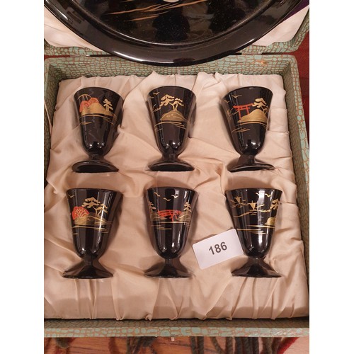 186 - Oriental Laquered Drinks Set In Fitted Case Consisting Of Tray And 6 Goblet Cups