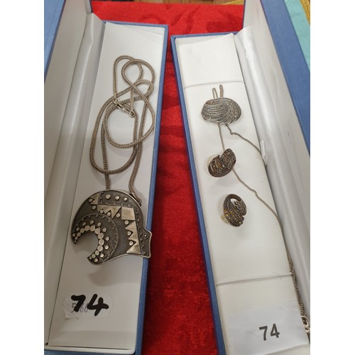 74 - 2 Silver Neclaces With Pendants And Ear Rings