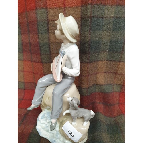 123 - Large Lladro Figure Boy On Rock With Toy Sailing Boat And Dog Stands 24cms Tall