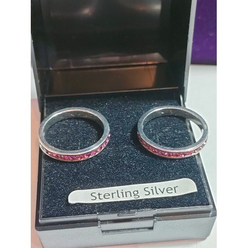 26 - Pair of sterling silver purple stone ring s.