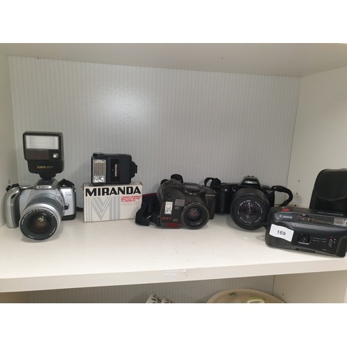 169 - Shelf Of Cameras Cannon E05 300V Olympus NZ 330 Super Zoom Minolta Dynax 3 Xi  Cannon Snappy And Fla... 