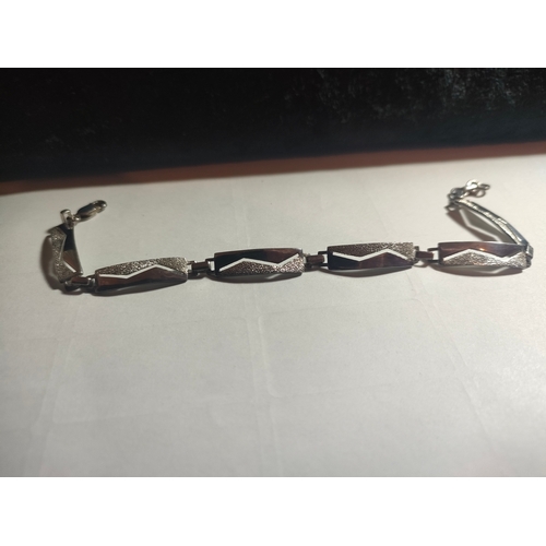 39 - Heavy Silver linked set bracelet .