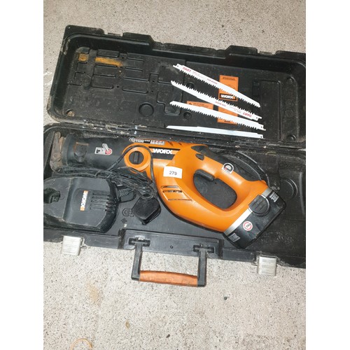 279 - Large Heavy Duty Pendulum Action Saw With Blades And Charger In Fitted Case