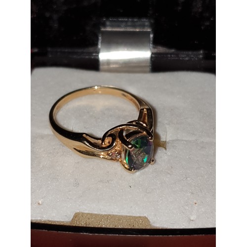 55 - Beautiful 14ct Gold Ring With Blue Irredescent Stone With Small Diamond Chips To Shoulders