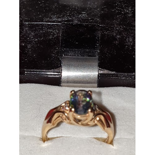 55 - Beautiful 14ct Gold Ring With Blue Irredescent Stone With Small Diamond Chips To Shoulders