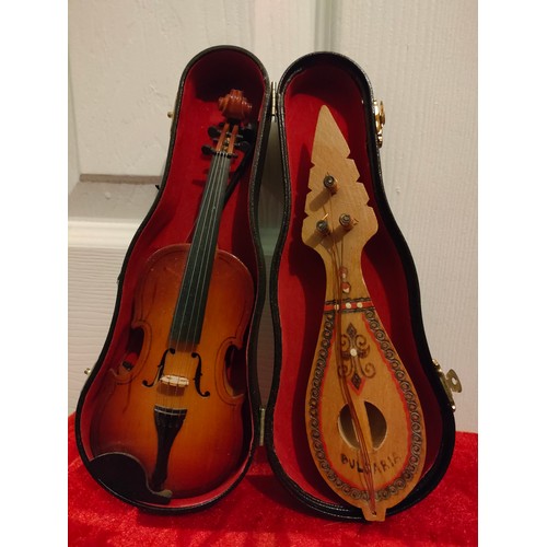 55 - 2 Novelty musical instruments ornament s with case.