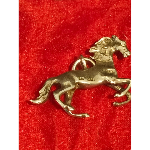 52 - Heavy Silver hall horse pendant approximately 2 inches in length.