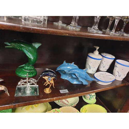 343 - Shelf Of Dolphin Items