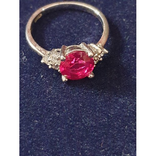 18 - White Metal Ring Marked 18k gp With Red Stone Centre And Clear Stones On Shoulders size P