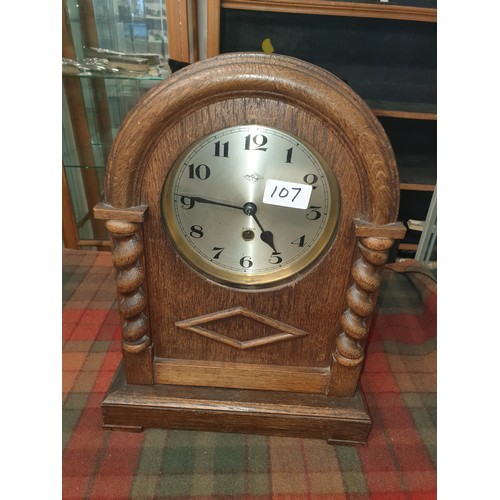 110 - A Beautiful Oak Cased Mantel Clock  With Barley Twist Design To Front With Key And Pendulum Winds Ti... 