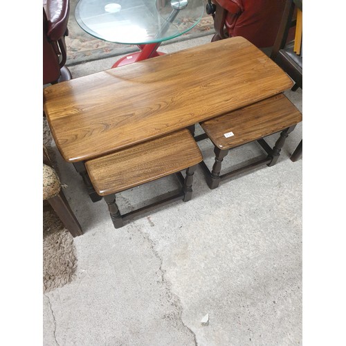 252 - Ercol Solid Oak coffee table with fitted nest of tables