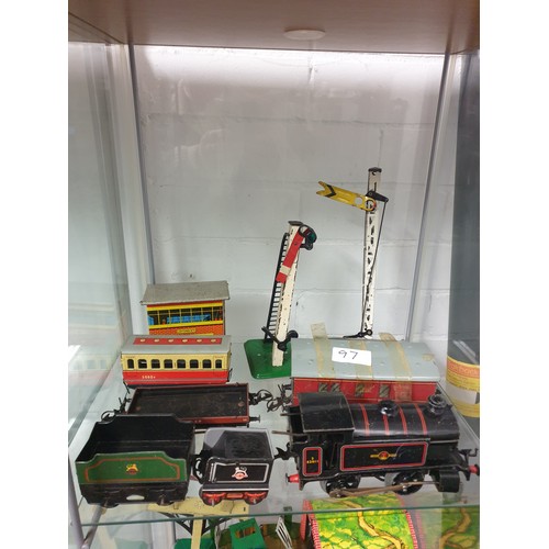 97 - 2 Shelves Of 0 Gauge Tin Plate Trains And Accessories ect