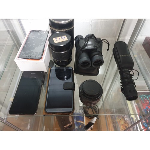 219 - A Selection Of Mobile Phones Binoculars Camera Lenses Etc