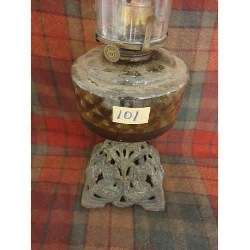 101 - A Victorian Oil Lamp With Clear Glass Reservoir Cast Iron Base Funnel And Wick