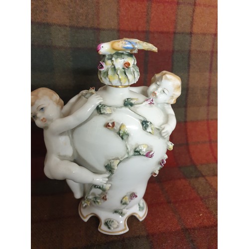 81 - A Pair Of Portuguese Pottery Cherub Drinks Flasks With Cherub Handles Bird Finial Stoppers