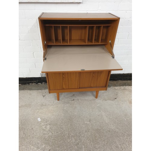 224 - A mid century Schreiber teak Writing Bureau Sliding Door Storage Cabinet