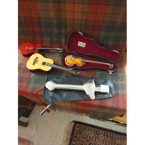 149 - 3 Miniature Guitars And Telescopic Practise Sword With Pouch