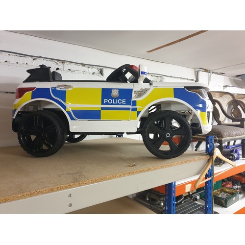 67 - A Childs Sit On Electric Police Car With Charger And Remote Control