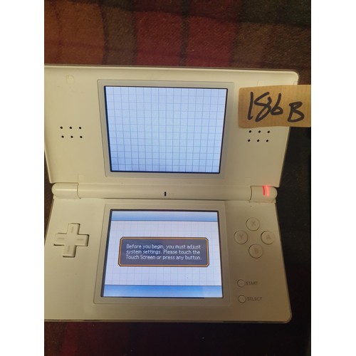 186B - Nintendo DS With Lots Games  No Power Lead