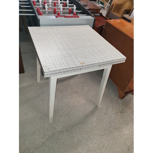 265 - A mid century Formica topped table by PHG &Sons  Guildform Guilford