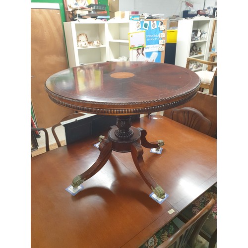 266 - Large Reproduction Flip Top Table With Inlaid Top And Brass Caster Feet