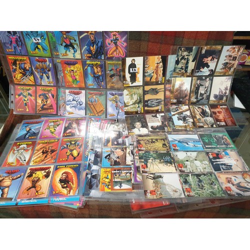 84 - A collection of collectable X-Men series cards along with a vintage collection of planets of the ape... 