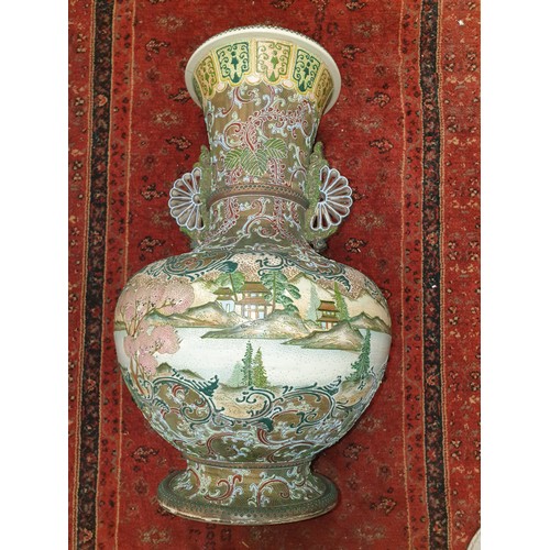 87 - A large Chinese 19th century vase depicting pagoda scene [ damage to the base ]