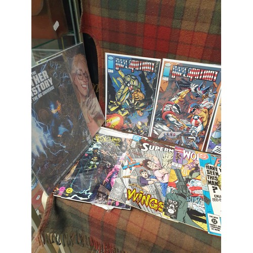 89 - A collection of vintage DC comics includes super patriot issue 1, black label DC The history of the ... 