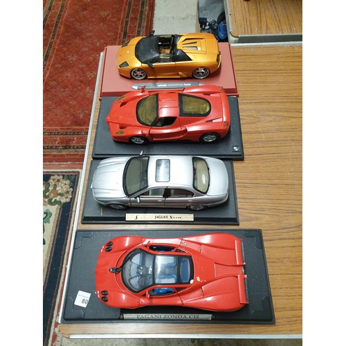 80 - 4 Large Scale Sports Cars On Plinths