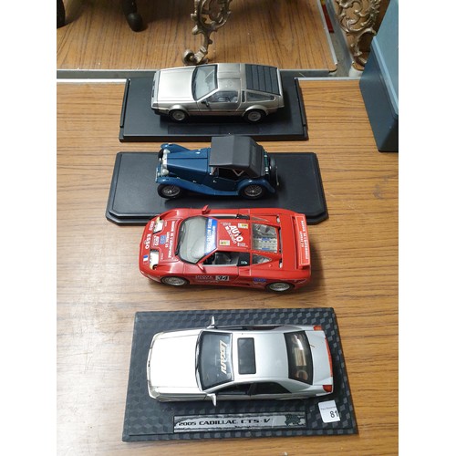 81 - 4 Assorted Large Scale Sports Cars On Plinths