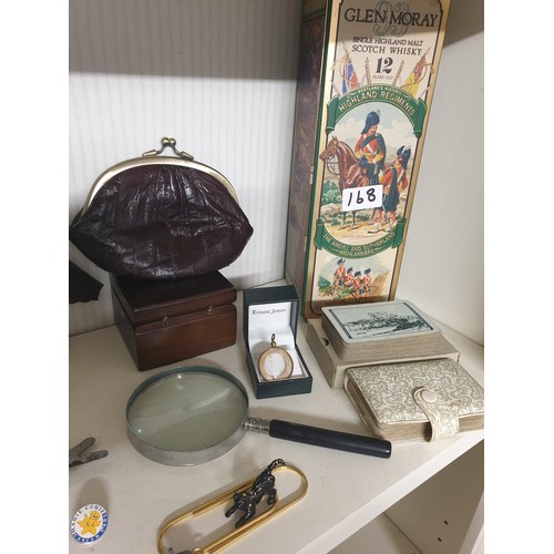 168 - Shelf Of Collectables To Include Watches, Whisky Tin, Eel Skin Purse Cards, Barrow Scoops Coins  etc