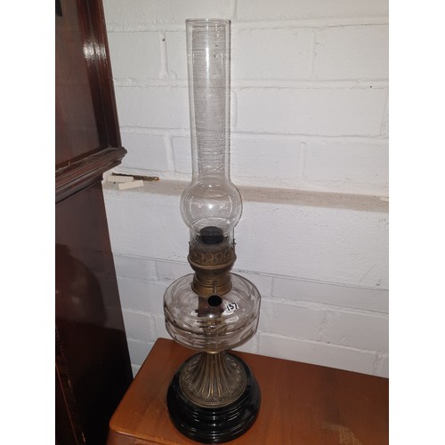 137 - Early 1900s Oil Lamp With Glass Funnel And Cast Metal Base