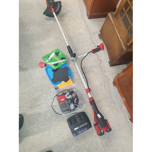 176 - Huge Heavy Cordless Duty Strimmer With Charger Spare Metal Blades And Accessories